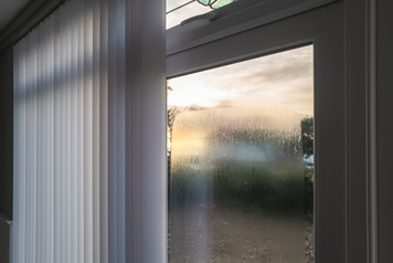 Window condensation occuring on the outside of a window, seen in the morning.